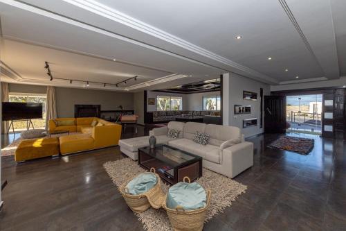 a living room with a couch and a table at Asmae House in Skhirat