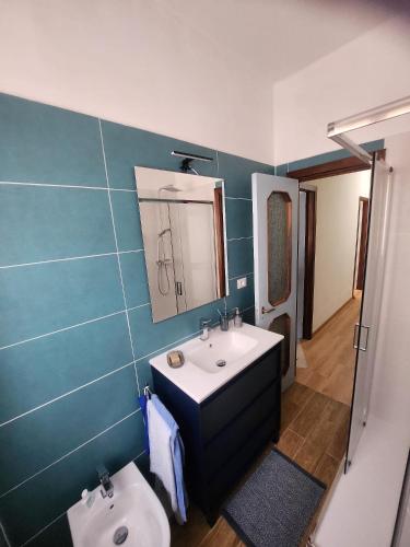 a bathroom with a sink and a toilet at Maja in Chiavari