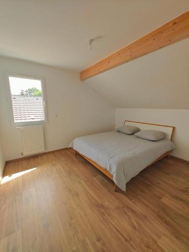 Giường trong phòng chung tại Villa proche du centre