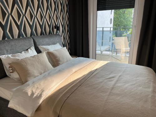 Ένα ή περισσότερα κρεβάτια σε δωμάτιο στο Apartament Centro z bezpłatnym garażem