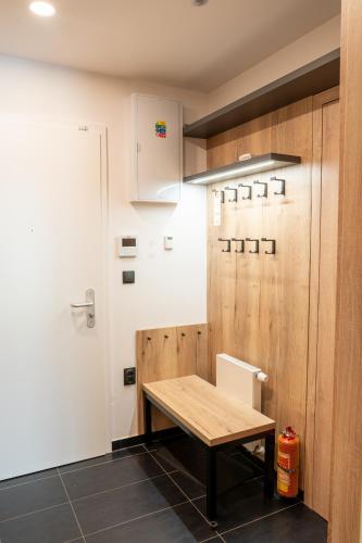a kitchen with a wooden table in a room at Apartmán Maruška in Dolní Morava