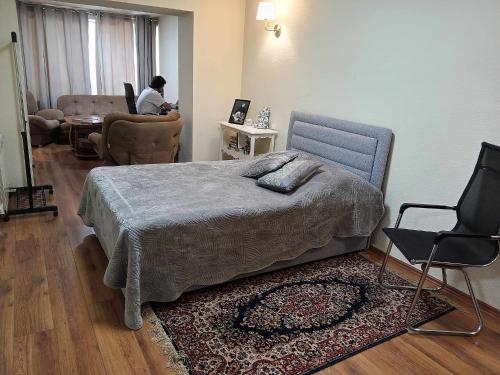 Ένα ή περισσότερα κρεβάτια σε δωμάτιο στο Saburtalo Apt