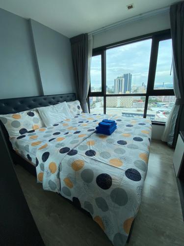 Postel nebo postele na pokoji v ubytování The Base Central Pattaya #16