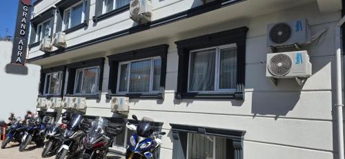 a row of motorcycles parked on the side of a building at GRANDAURA EDıRNE in Edirne