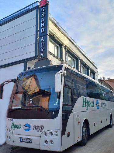 a white bus parked in front of a building at GRANDAURA EDıRNE in Edirne