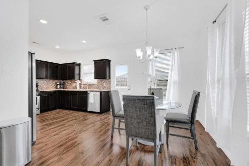 a kitchen and dining room with a table and chairs at Charming accommodation in Houston! in Houston