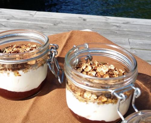 two jars of dessert with nuts in them on a table at Sälstationen - The seal station 