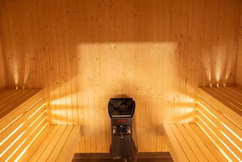 a room with two benches in a sauna at Camp Gielas, Arvidsjaur in Arvidsjaur