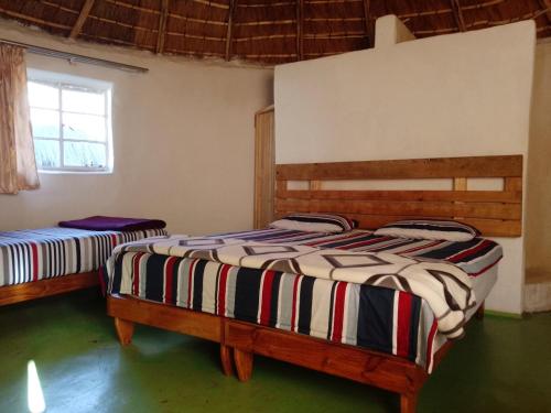 Ένα ή περισσότερα κρεβάτια σε δωμάτιο στο Ha Ramabanta Riverside