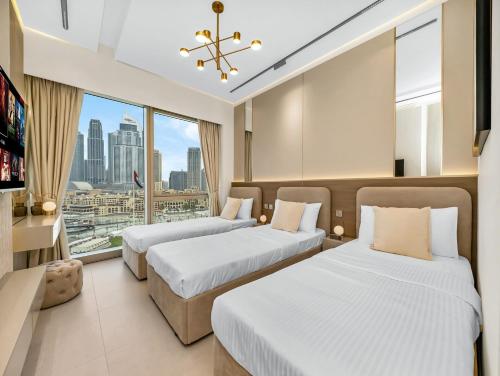 Ένα ή περισσότερα κρεβάτια σε δωμάτιο στο Burj Khalifa -New Year Show ,Dubai Fountain , 5 mins from Dubai Mall