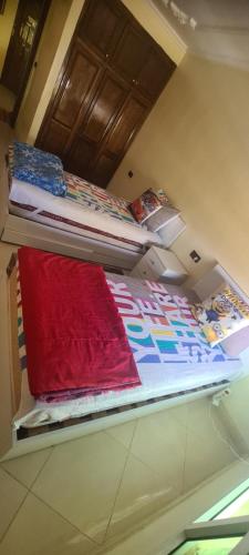 two bunk beds sitting on a shelf in a room at لولو بيتي in Nador