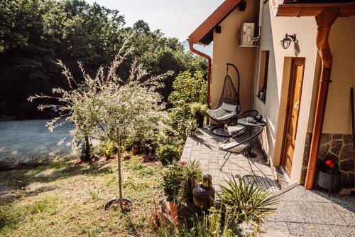 a house with a garden with plants in the yard at Kuća za odmor LE-LA in Cvetlin