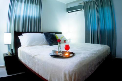 Postel nebo postele na pokoji v ubytování Hotel Casa Jum