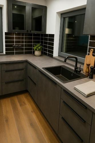a kitchen with a sink and a counter at Ferienhaus Heimatliebe in Horperath