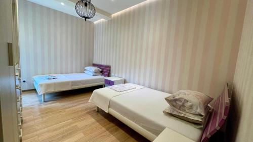 Postel nebo postele na pokoji v ubytování Vile, Perla Resort