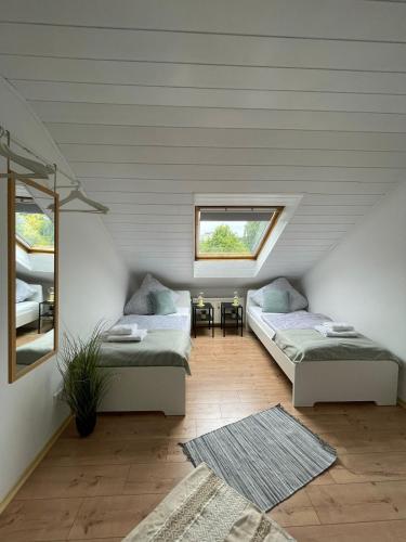 Postel nebo postele na pokoji v ubytování Charmante Dachgeschosswohnung bis zu 6 Gäste