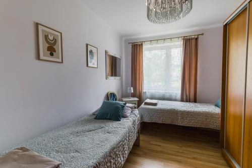 En eller flere senge i et værelse på Górski Apartament pod Stokiem
