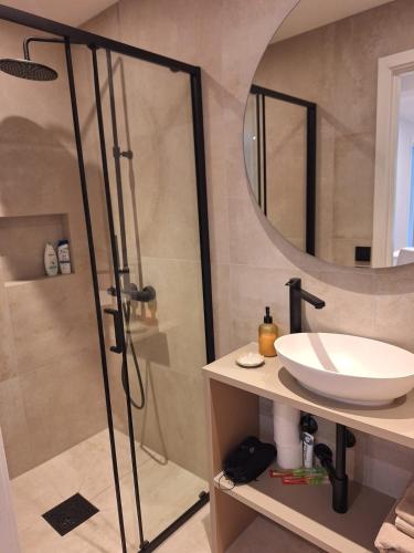 a bathroom with a shower and a sink at Fjord Nest in Bergen