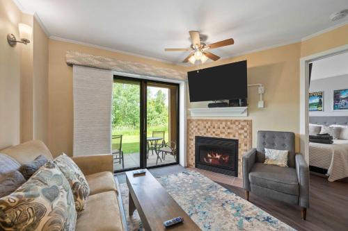 a living room with a couch and a fireplace at Cozy 1 Bedroom Condo Holiday Valley in Ellicottville