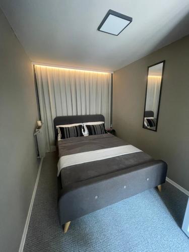 a bedroom with a large bed in a room at Robert Local Social Restaurant & Accomodation in Hîrşova