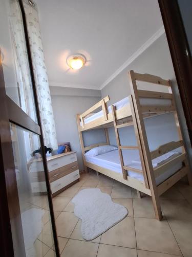 Кровать или кровати в номере Sina House