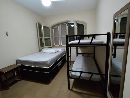 Postel nebo postele na pokoji v ubytování L'Harmonie 5 suítes, salão jogos, piscina, churrasqueira, amplo terraço