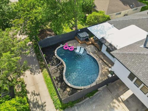 an overhead view of a swimming pool in a backyard at Spacious 5BR Getaway with Pool in Duncanville