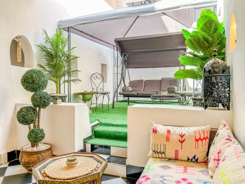 a living room with a couch and a bed at Riad Sifaw & Spa Marrakech in Marrakech