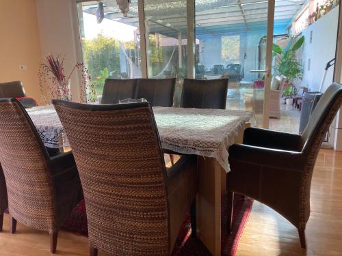a dining room with a table and chairs at Homestay Free Park&Bikes in Ljubljana