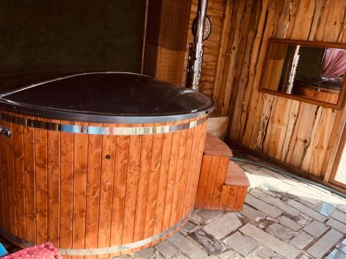 a large wooden tub sitting inside of a building at Kresy Wschodnie in Okszów
