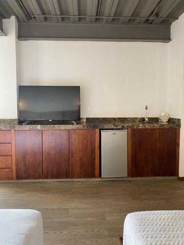 a room with a large flat screen tv on a counter at Yaxche in Cancún