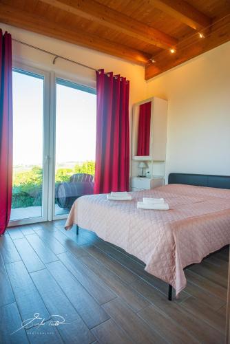 Ένα ή περισσότερα κρεβάτια σε δωμάτιο στο Casa Vacanze Elios