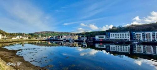 a body of water with buildings and a city at 6 New Street Bantry Selfcatering BnB Apartment 1 in Bantry