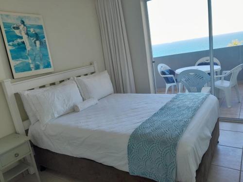 Ένα ή περισσότερα κρεβάτια σε δωμάτιο στο Executive Umhlanga apartment