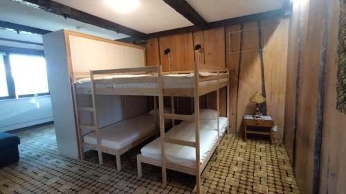 a room with two bunk beds and a lamp at Ruth's bed and own breakfast in Skutskär