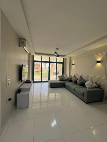 a large living room with a couch and a tv at Beach Villa in Ras Sidr at Red Sea in Ras Sedr