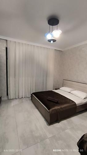 a bedroom with a large bed in a room at White House gabala 