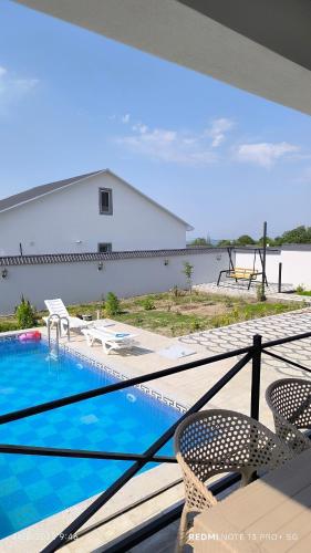a view of a swimming pool from the balcony of a house at White House gabala 