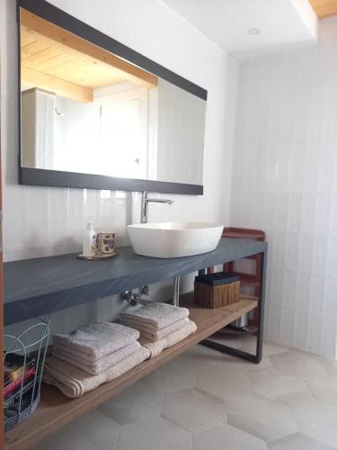 a bathroom with a sink and a mirror at Luce del Mattino in San Vito al Tagliamento