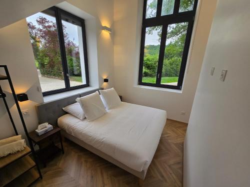 Postel nebo postele na pokoji v ubytování La mezzanine by Vindihouses