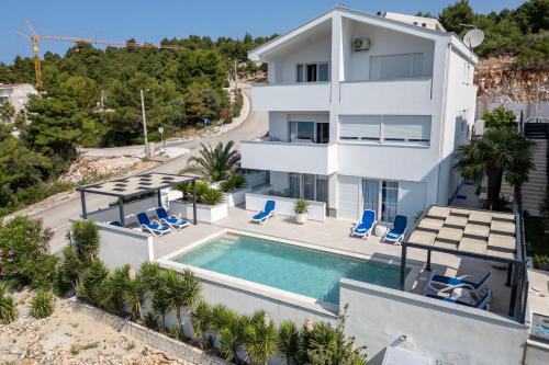 an aerial view of a house with a swimming pool at Villa Mare in Klek