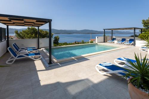 a villa with a swimming pool with a view at Villa Mare in Klek