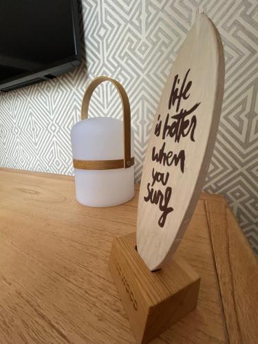 a wooden paddle sitting on top of a wooden table at Dania Home Noia in Noya