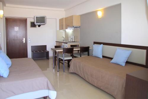 Ένα ή περισσότερα κρεβάτια σε δωμάτιο στο Agela Hotel & Apartments