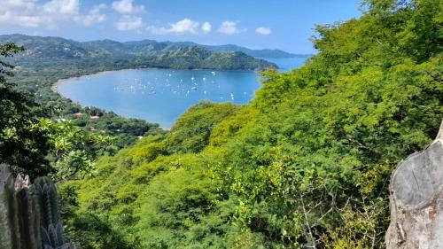 a view of a lake from a mountain at Villa Prados del Rio - Guanacaste, Costa Rica in Comunidad