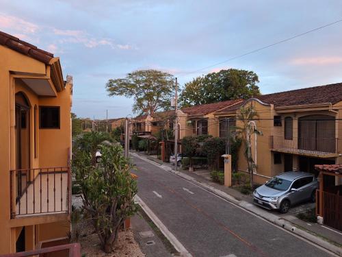 a small car parked on the side of a street at Villa Prados del Rio - Guanacaste, Costa Rica in Comunidad