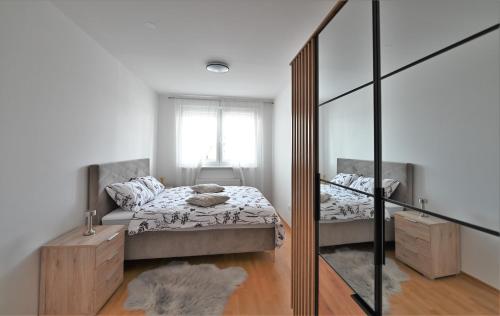 a bedroom with two beds and a mirror at Katia in Zagreb