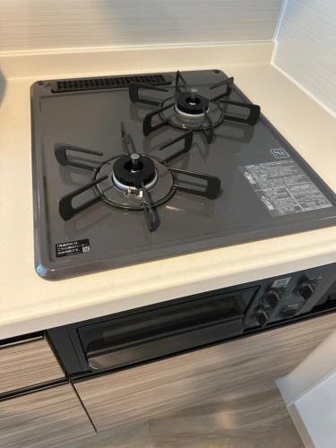 a stove top oven sitting on top of a counter at Stisfy サティスファイ in Chitose