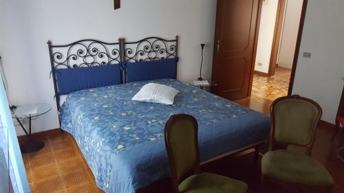 מיטה או מיטות בחדר ב-Allevamento B&B
