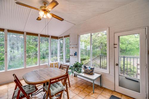 a dining room with a table and chairs and windows at Breweries, Hiking Trails and Museums Monument House in Monument